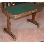 A 19th century rosewood library table, the rounded rectangular top with green leather skiver above