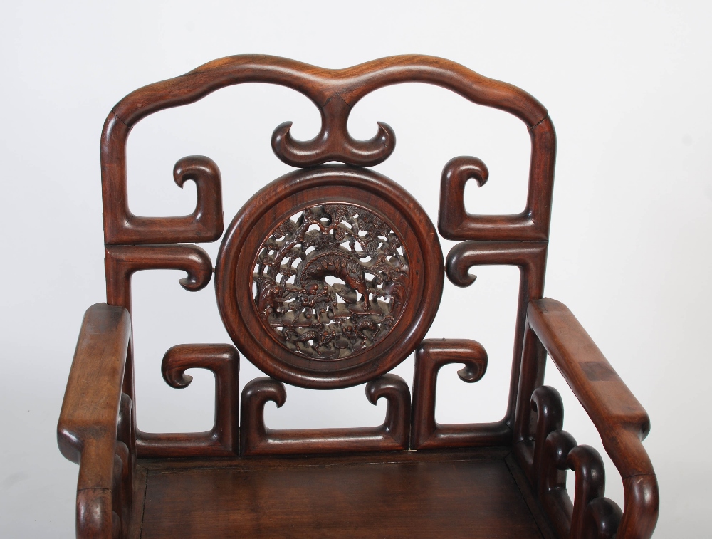 A Chinese carved darkwood armchair, late 19th/ early 20th century, the shaped back rail enclosing - Image 2 of 7