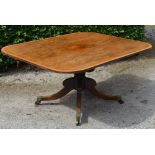 A 19th century rosewood snap top supper table, the hinged rounded rectangular top on a cylindrical