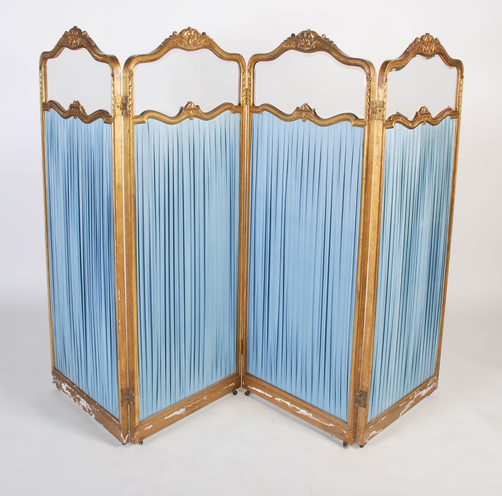 A late 19th / early 20th century French glazed giltwood four section room divider / screen, of