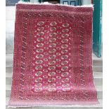 A late 19th / early 20th century Tekke rug, the rectangular field decorated with three rows of