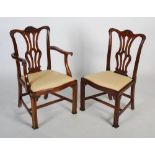 A set of ten early 20th century carved mahogany dining chairs in the Georgian Chippendale style,