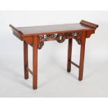 A Chinese dark wood alter table, late 19th/ early 20th century, the rectangular panelled top with