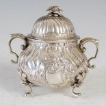 A continental white metal twin handled bowl and cover, probably 18th century, marks rubbed, with