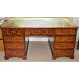 A 19th century mahogany and marquetry inlaid partners desk, the rectangular top with green and