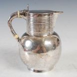 A Victorian Aesthetic Movement silver hot water pot, London, 1884, makers mark possibly WH, the neck