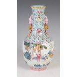 A Chinese porcelain famille rose turquoise-blue ground bottle vase, 20th century, bearing Qianlong