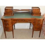 An Edwardian mahogany and marquetry inlaid writing desk, the rectangular top with green skiver, open