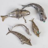 A collection of five late 19th / early 20th century white metal articulated fish, of assorted