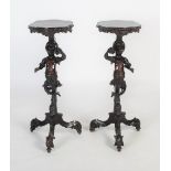 A pair of late 19th / early 20th century Italian Venetian carved ebonised torchiere stands, in the