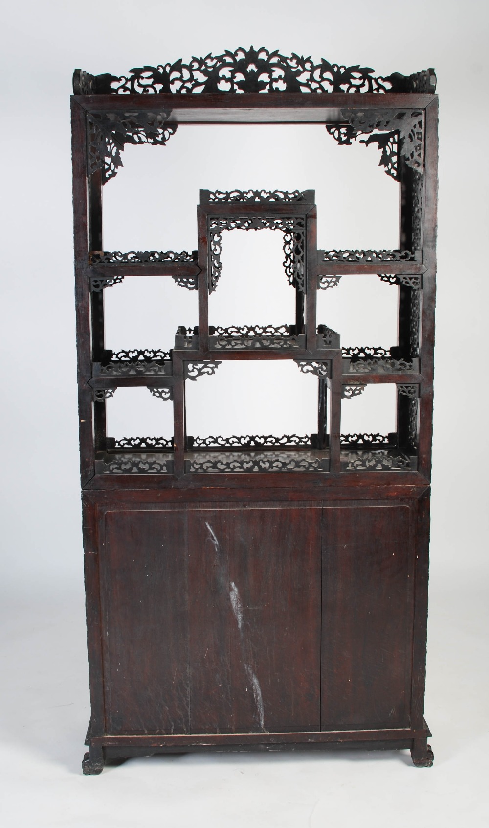 A Chinese carved darkwood display cabinet, Qing Dynasty, the arched top with a carved pediment - Image 11 of 11