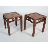 A pair of Chinese darkwood square occasional tables, Qing Dynasty, rectangular tops with recessed