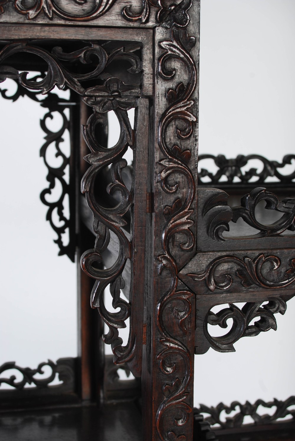 A Chinese carved darkwood display cabinet, Qing Dynasty, the arched top with a carved pediment - Image 9 of 11