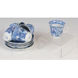 A set of four Chinese porcelain blue and white tea cups and saucers, Qing Dynasty, decorated with