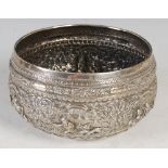 A late 19th/ early 20th century Indian silver bowl, with embossed decoration of figures, animals and