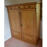 A late 19th century Aesthetic Movement birds eye maple press cupboard, the rectangular top above