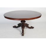 A Victorian mahogany centre table, the oval shaped top raised on a turned cylindrical support on