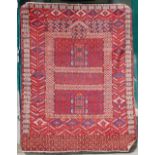 An early 20th century Persian carpet, the scarlet garden design field set within angular medallions,