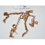 A PART 9CT GOLD CHAIN TOGETHER WITH A YELLOW METAL CHARM BRACELET SUSPENDING FIVE ASSORTED CHARMS,