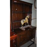 AN EARLY 20TH CENTURY STAINED OAK DRESSER