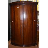 A MAHOGANY AND BOXWOOD LINED HANGING CORNER CUPBOARD WITH DENTAL FRIEZE