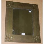 AN EARLY 20TH CENTURY BRASS WALL MIRROR, POSSIBLY SCOTTISH, WITH FOUR PIERCED PANELS TO THE