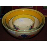 THREE CLARICE CLIFF BIZARRE CROCUS PATTERN BOWLS OF GRADUATED SIZE, THE LARGEST 22CM DIAMETER