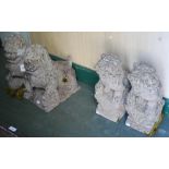 GROUP OF FOUR COMPOSITE STONE GARDEN SHISHI DOG ORNAMENTS