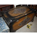 CHINESE CAMPHOR WOOD BLANKET BOX WITH CARVED DECORATION OF FIGURES AND PINE TREES