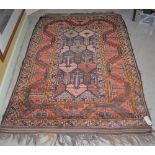 BALUCHI RUG, 20TH CENTURY, THE RECTANGULAR GROUND DECORATED WITH STYLISED FOLIATE MOTIFS WITHIN A