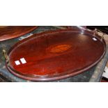 A MAHOGANY TWIN HANDLED OVAL TRAY WITH CENTRAL SHELL INLAY