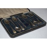 A CASED SET OF SIX SHEFFIELD SILVER TEASPOONS, TOGETHER WITH PAIR OF ELECTROPLATED SUGAR TONGS