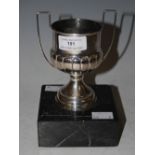 WHITE METAL TWO-HANDLED TROPHY MOUNTED ON MARBLE PLINTH STAMPED '925'