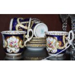 SIX COALPORT COBALT BLUE GROUND COFFEE CANS AND SAUCERS WITH PRINTED AND HAND PAINTED FLORAL