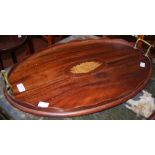 A MAHOGANY TWIN HANDLED OVAL TRAY WITH CENTRAL SHELL INLAY