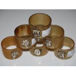 SET OF SIX SILVER-MOUNTED HORN NAPKIN RINGS