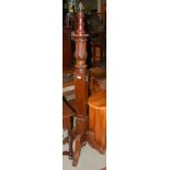 A CARVED MAHOGANY STANDARD LAMP ON FOUR DOWNSWEPT SUPPORTS