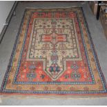 A 20TH CENTURY PERSIAN PRAYER RUG, THE MIHRAB SHAPED FIELD DECORATED WITH STYLISED FLOWERS ON AN