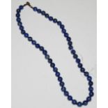 A SINGLE STRAND LAPIS LAZULI BEAD NECKLACE IN MICHEL MENDE BOX WITH CERTIFICATE
