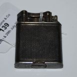 AN EARLY 20TH CENTURY WHITE METAL 'DUNHILL' LIGHTER, PAT NO. 143752