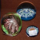 A BLUE GROUND MILLEFIORI PAPERWEIGHT, TOGETHER WITH A SMALLER BLUE GROUND MILLEFIORI PAPERWEIGHT AND