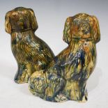PAIR OF SCOTTISH POTTERY GREEN, BLUE AND BROWN GLAZED POTTERY DOGS, 17.5CM HIGH