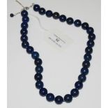 A SINGLE STRAND LAPIS LAZULI NECKLACE WITH WHITE METAL CLASPS STAMPED 925