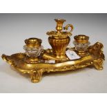 LATE 19TH CENTURY GILT METAL AND CLEAR GLASS DESK STAND IN THE ROCOCO STYLE