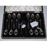 CASED SET OF TWELVE SHEFFIELD SILVER TEASPOONS AND TONGS