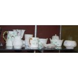 A COLLECTION OF BELLEEK PORCELAIN TO INCLUDE A SHELL SHAPED VASE, SHAMROCK PATTERN JUG, SHAMROCK