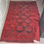 BOKHARA RUG, 20TH CENTURY THE EARTH-BROWN RECTANGULAR FIELD DECORATED WITH ALLOVER DESIGN OF LOZENGE