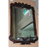 A PAIR OF MAHOGANY FRAMED WALL MIRRORS WITH SIMULATED BAMBOO AND FOLIATE CARVED DETAILS