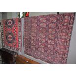 A 20TH CENTURY TEKKE RUG, THE RECTANGULAR GROUND DECORATED WITH ROWS OF TWELVE OCTAGONAL SHAPED