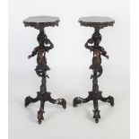A PAIR OF LATE 19TH / EARLY 20TH CENTURY ITALIAN VENETIAN CARVED EBONISED TORCHIERE STANDS, IN THE